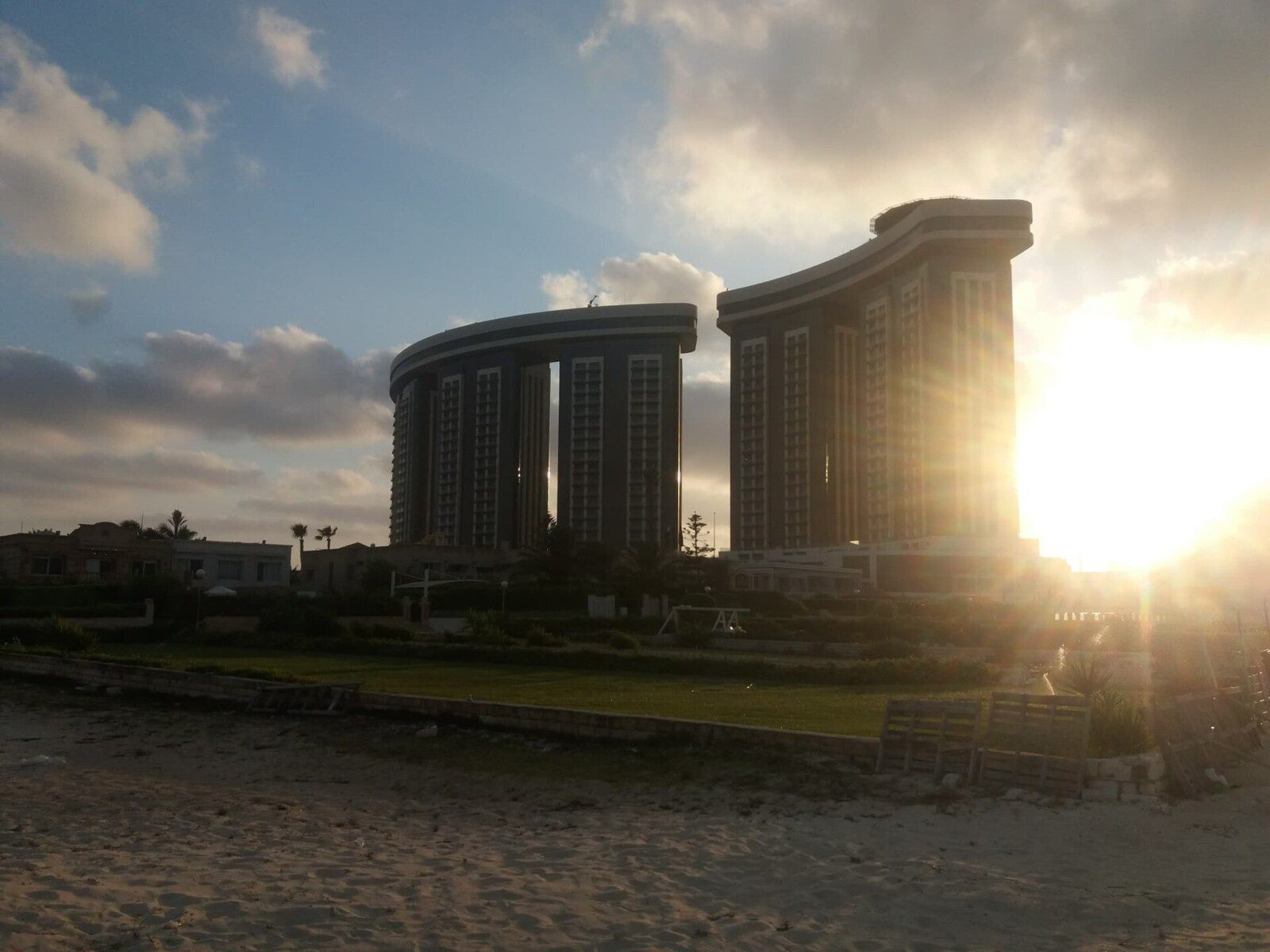 North Edge towers from the New Alamein shoreline at golden hour